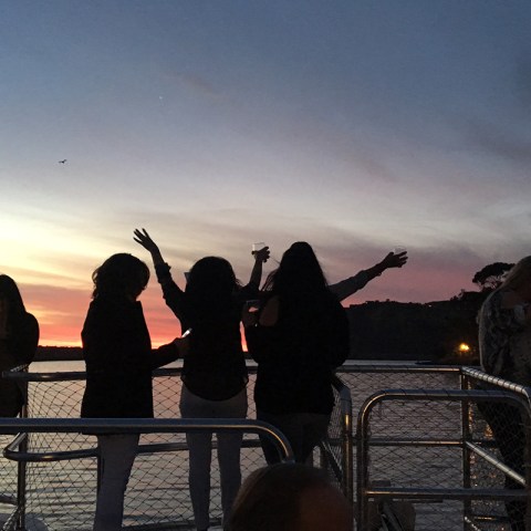 a group of people playing instruments and performing on a stage