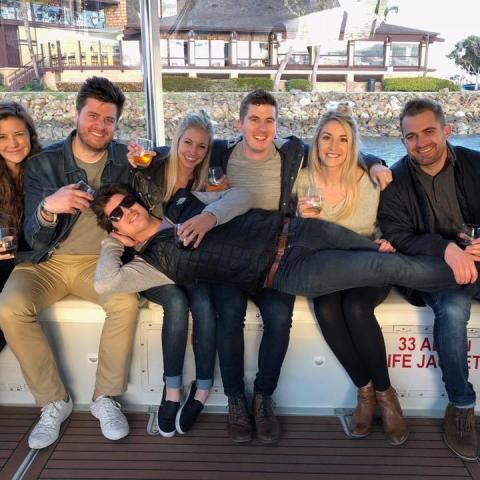 a group of people sitting posing for the camera