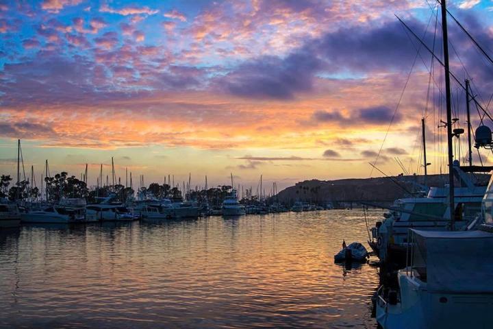 a boat is docked next to a body of water