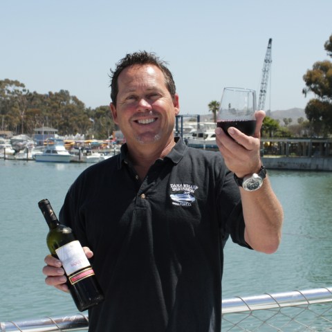 a man standing in front of a body of water