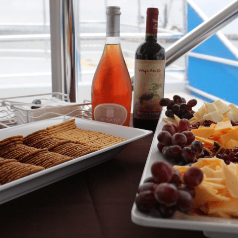 a plate of food and a bottle on a table