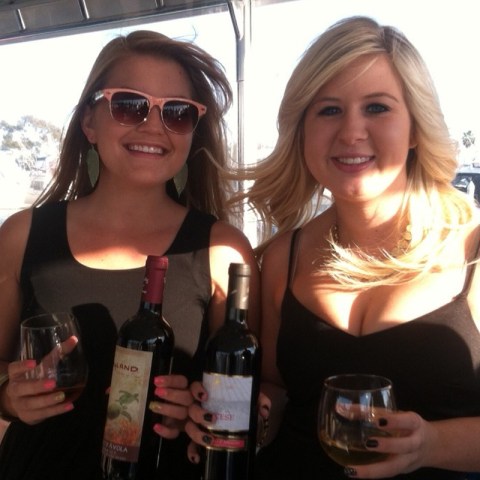 a woman holding a glass of wine